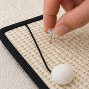 Natural sisal weave, twist-pin installation detail, and top-hanging pom-pom cord