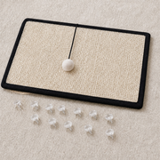 CornerClaw scratch pad with included pins and a pom-pom cord attached at the top
