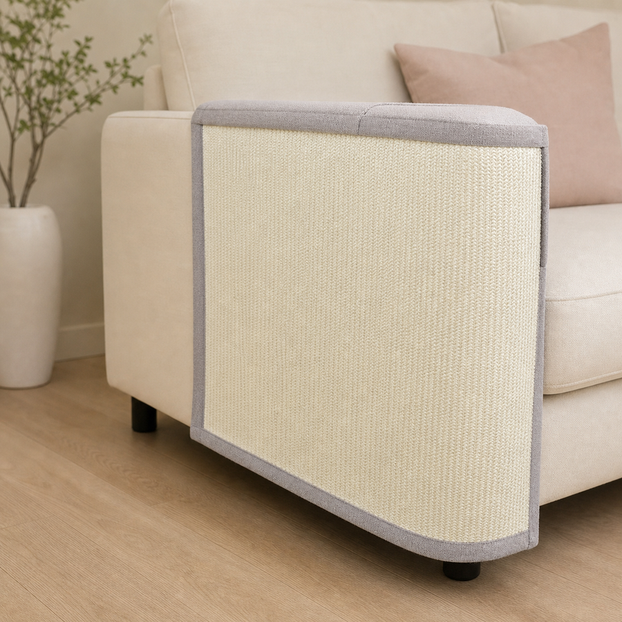 SofaShield sisal scratch guard fitted over a cream sofa arm
