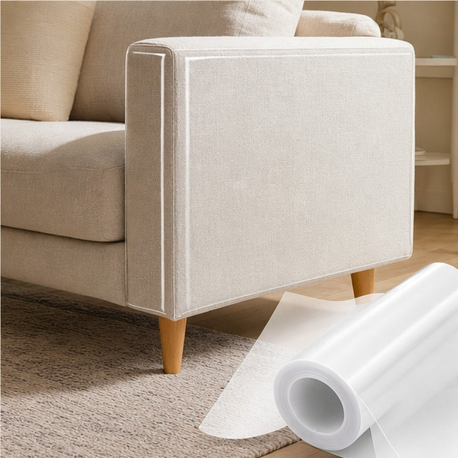 ClearClaw transparent furniture guard installed on a cream fabric sofa