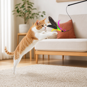 Orange cat pouncing toward the feather wand