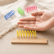 Compact Spring Fling cat toy shown to scale